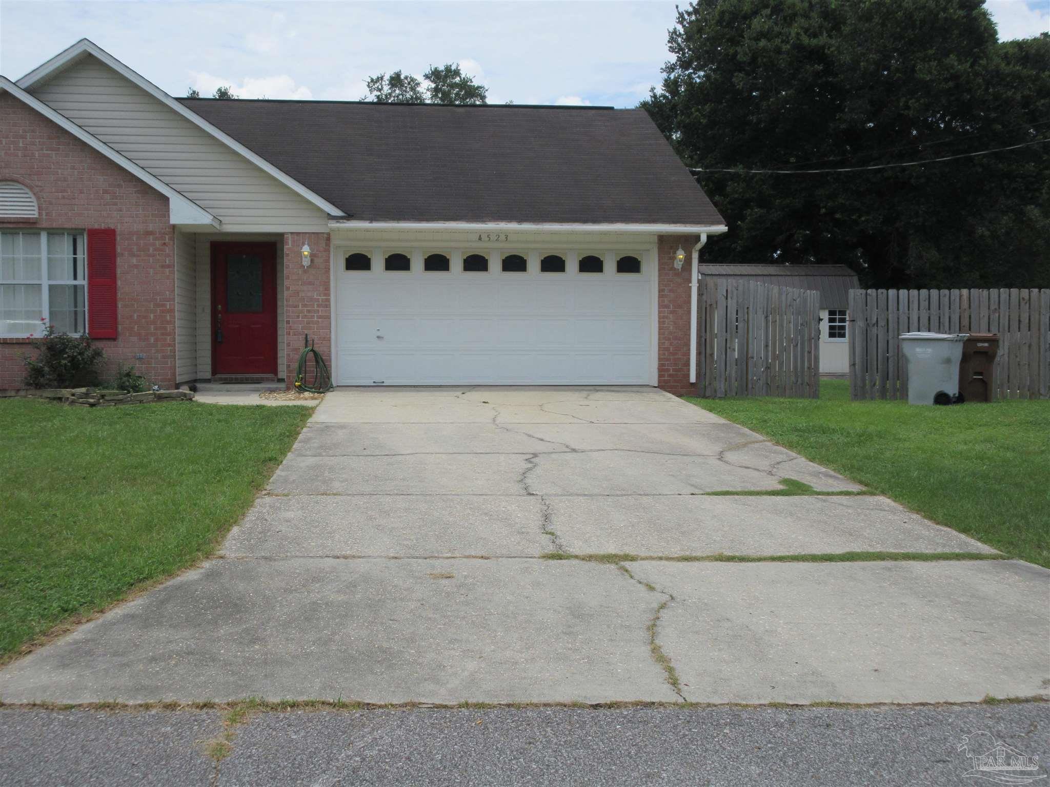 4523 Struth Lane Pace, FL 32571 - Photo 44 of 49 a front view of a house with a yard