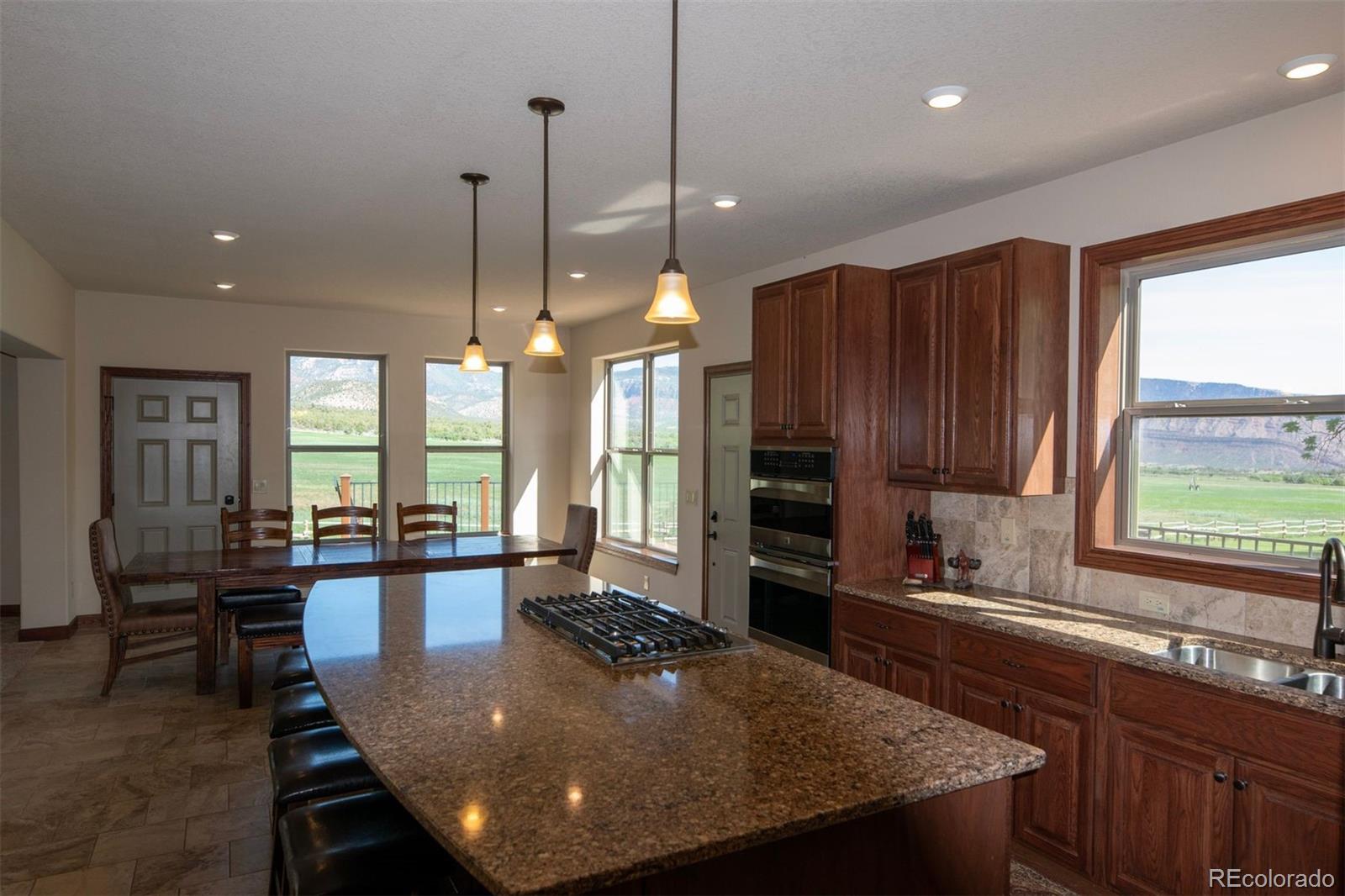 Undisclosed Address Paradox, CO 81429 - Photo 13 of 50 a large kitchen with kitchen island a large window in it