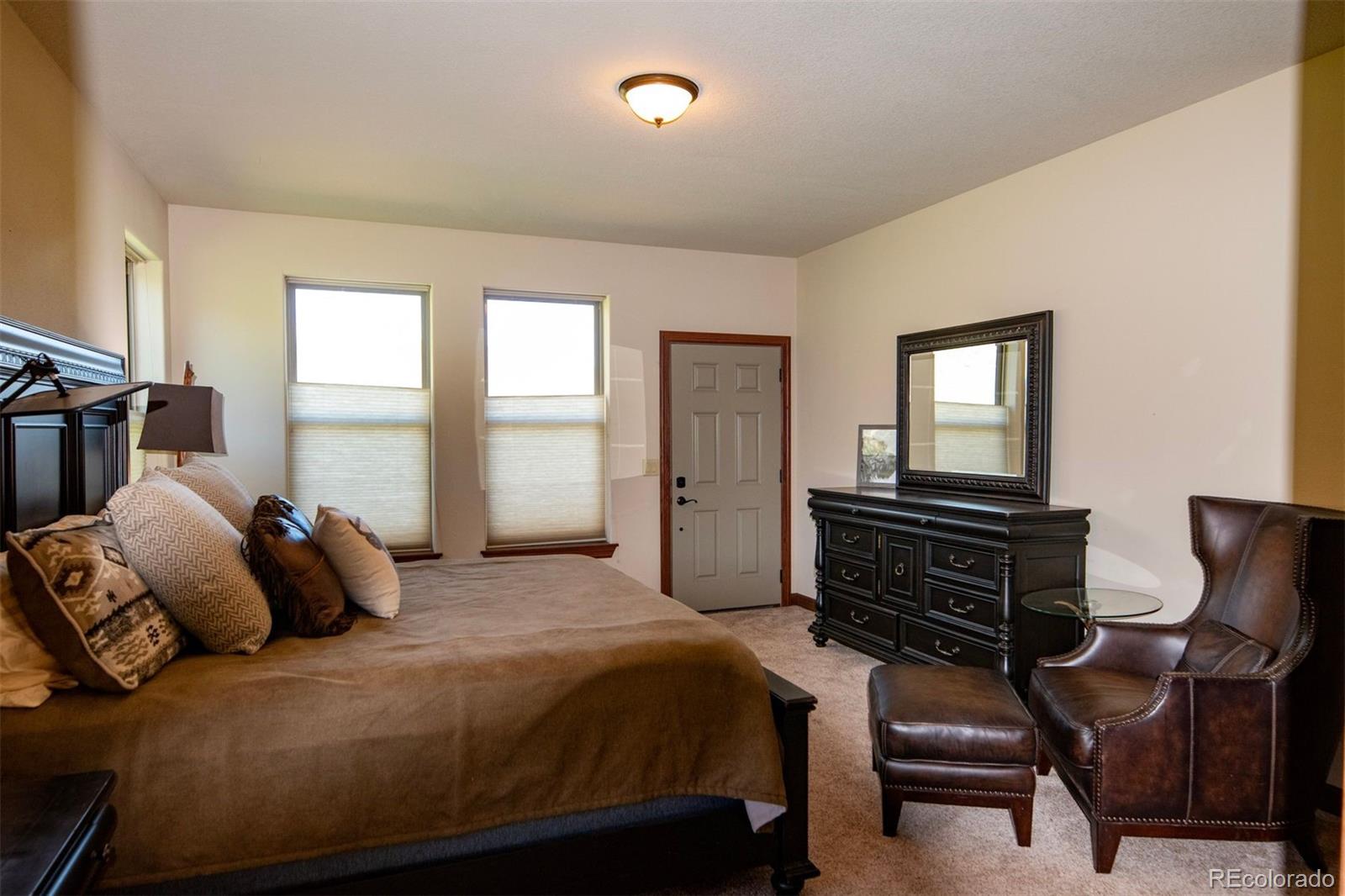 Undisclosed Address Paradox, CO 81429 - Photo 16 of 50 a bedroom with a bed and wooden floor