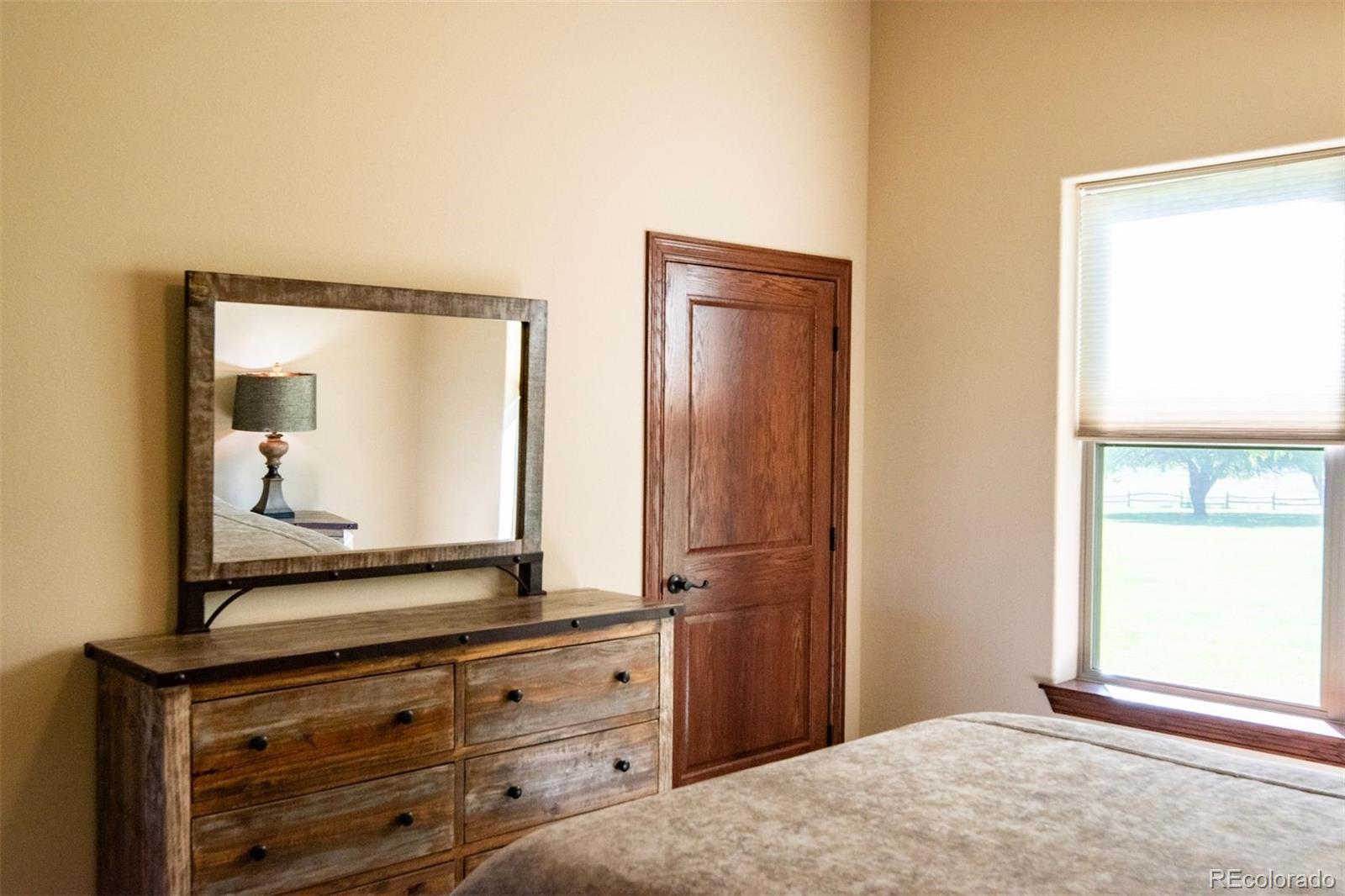 Undisclosed Address Paradox, CO 81429 - Photo 19 of 50 a bedroom with a bed and a mirror