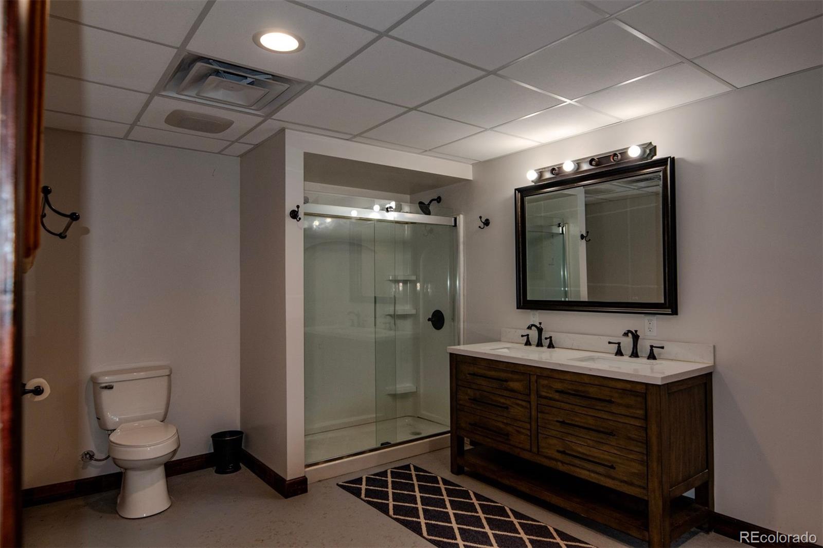 Undisclosed Address Paradox, CO 81429 - Photo 21 of 50 a bathroom with a sink toilet and shower