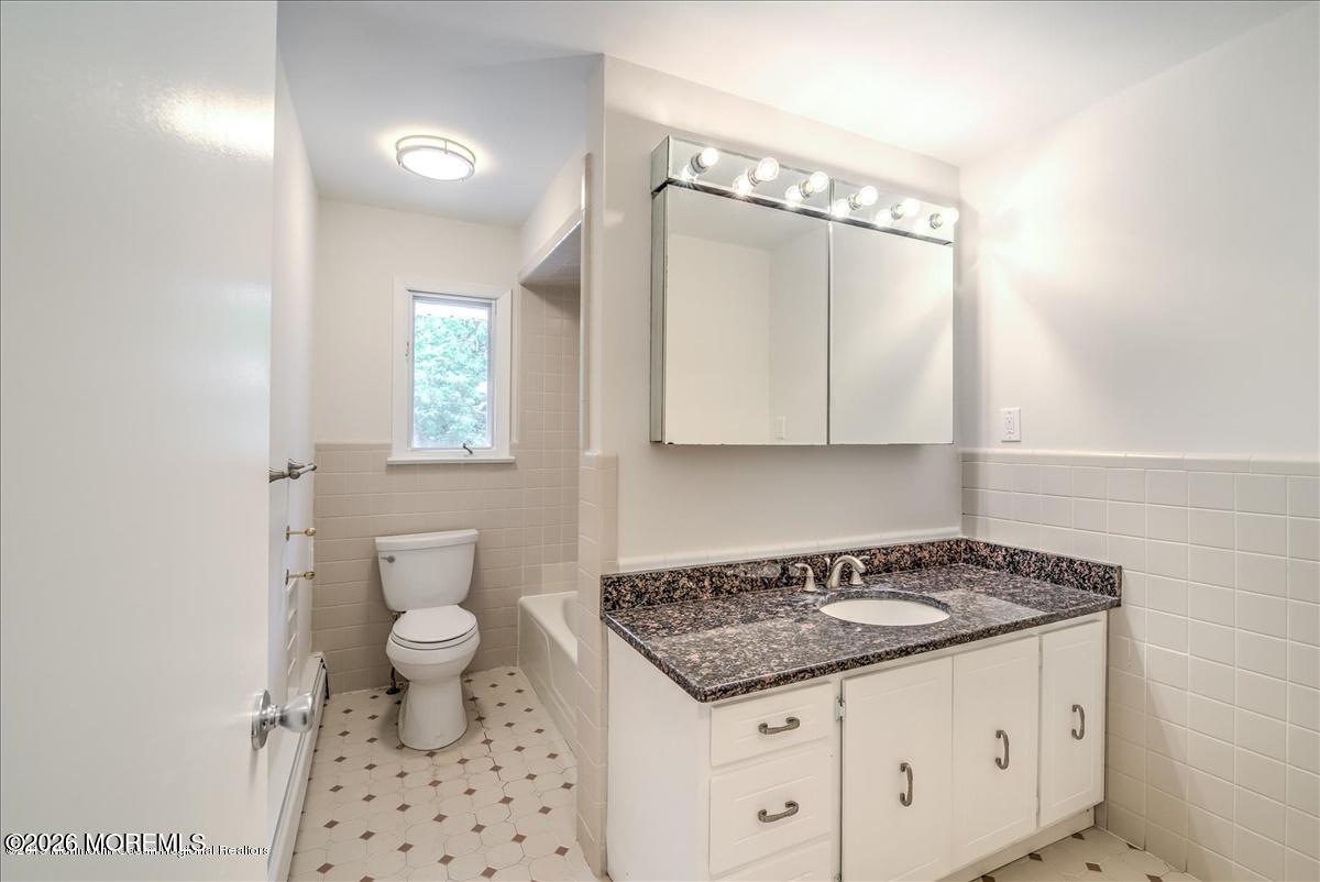 699 Aldrich Road Howell, NJ 07731 - Photo 18 of 23 a kitchen with a stove a sink and a refrigerator