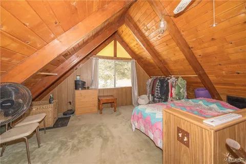 a view of storage and utility room with windows
