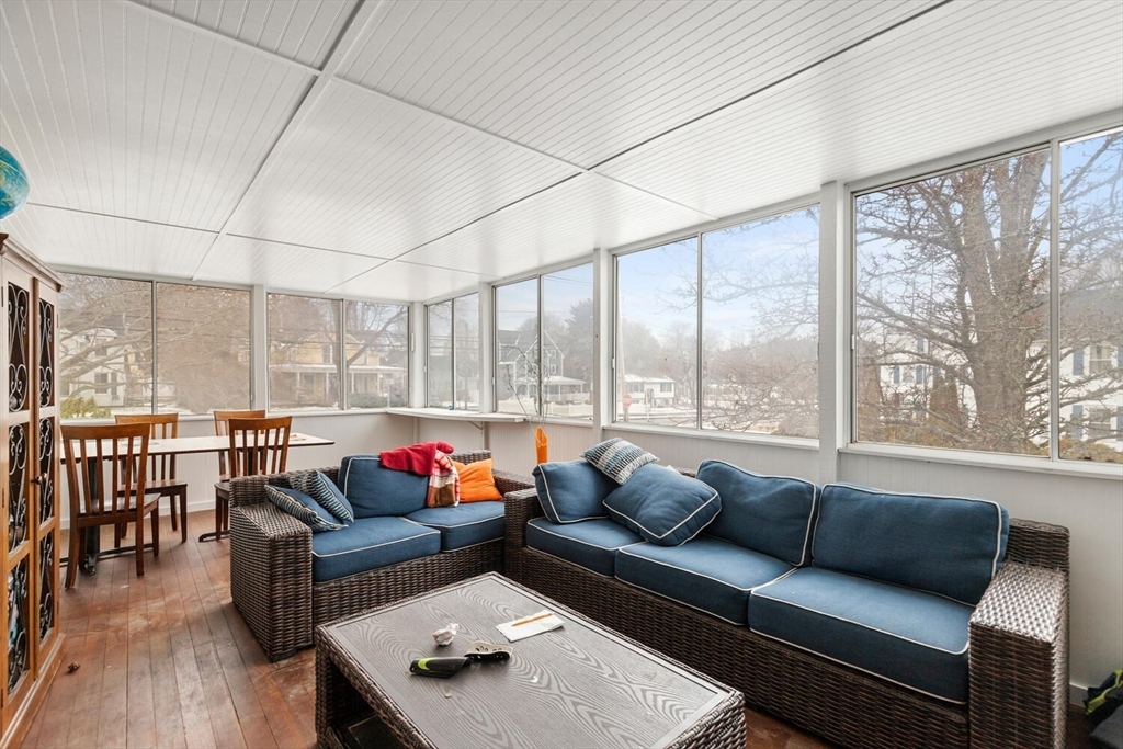 299 Asbury Street Hamilton, MA 01982 - Photo 14 of 37 a living room with furniture and a large window