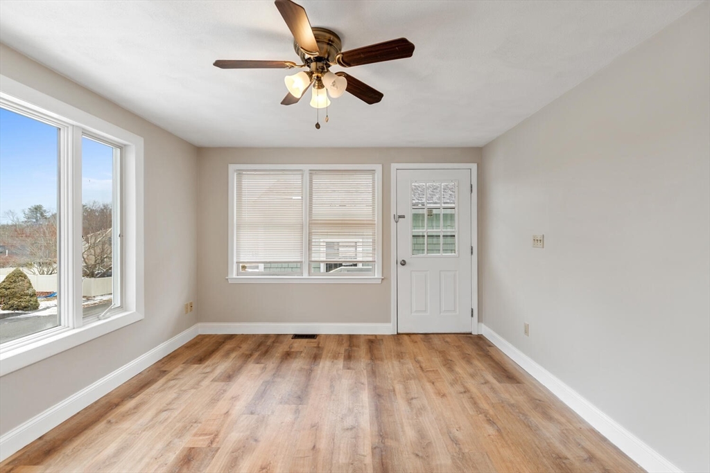 299 Asbury Street Hamilton, MA 01982 - Photo 21 of 37 a view of empty room with wooden floor and fan