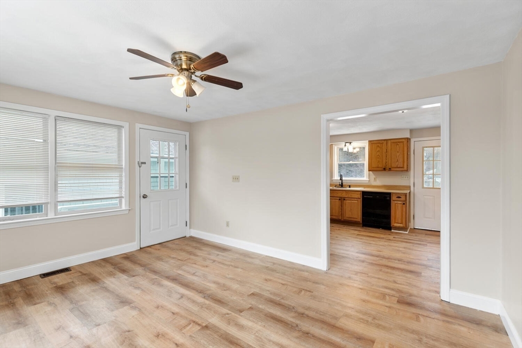 299 Asbury Street Hamilton, MA 01982 - Photo 23 of 37 a view of a livingroom with a ceiling fan and window