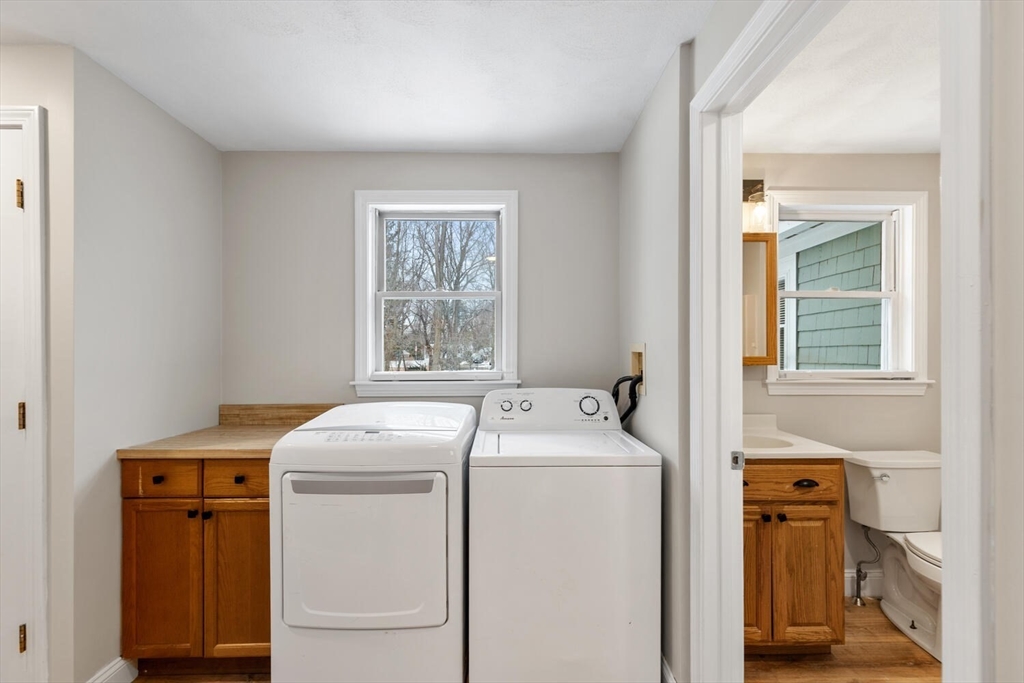 299 Asbury Street Hamilton, MA 01982 - Photo 24 of 37 a utility room with dryer and washer