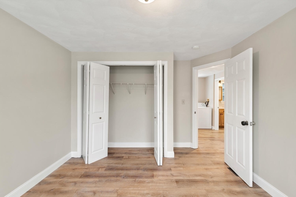 299 Asbury Street Hamilton, MA 01982 - Photo 29 of 37 a view of entryway with wooden floor
