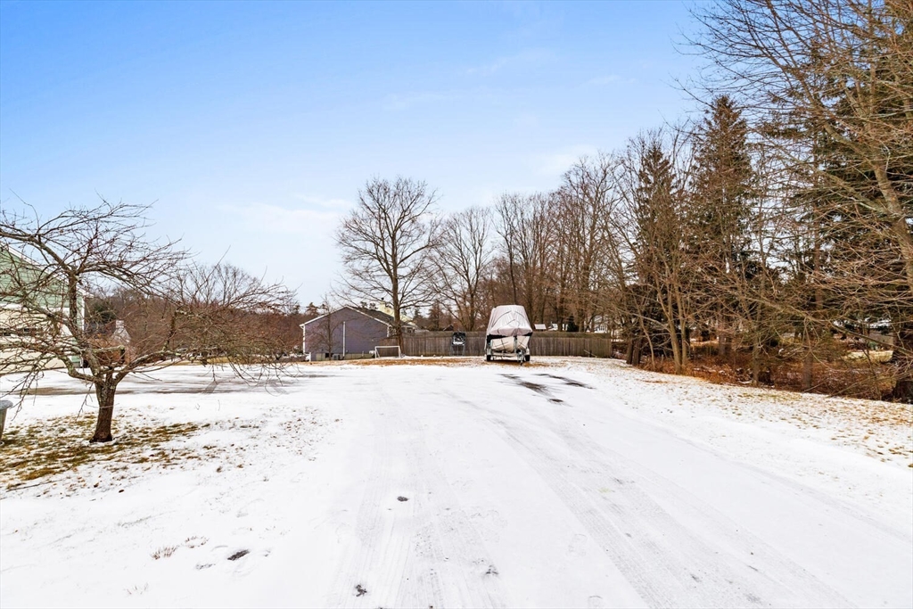 299 Asbury Street Hamilton, MA 01982 - Photo 31 of 37 a view of a snow on the side of the road