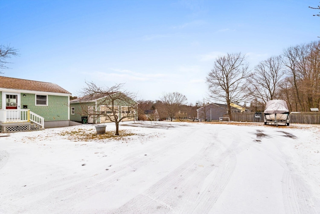 299 Asbury Street Hamilton, MA 01982 - Photo 32 of 37 a view of the snow on the road