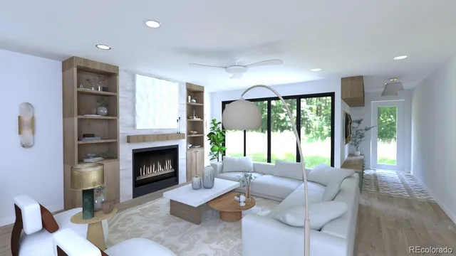 a living room with furniture fireplace and large windows