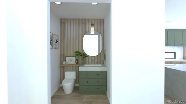 a bathroom with a toilet a sink and mirror