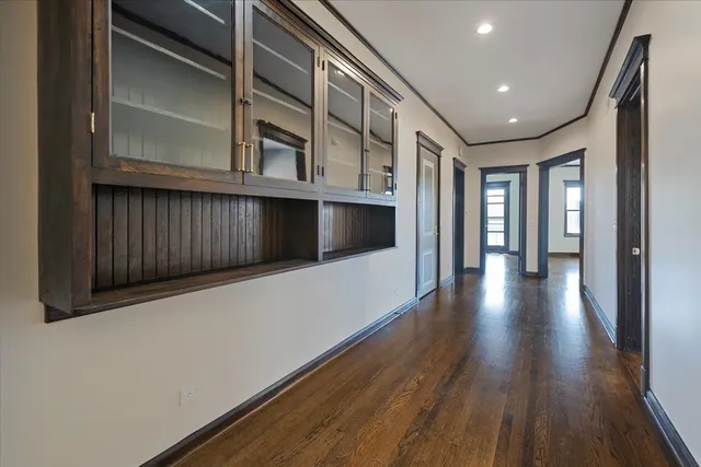 a view of gallery with wooden floor