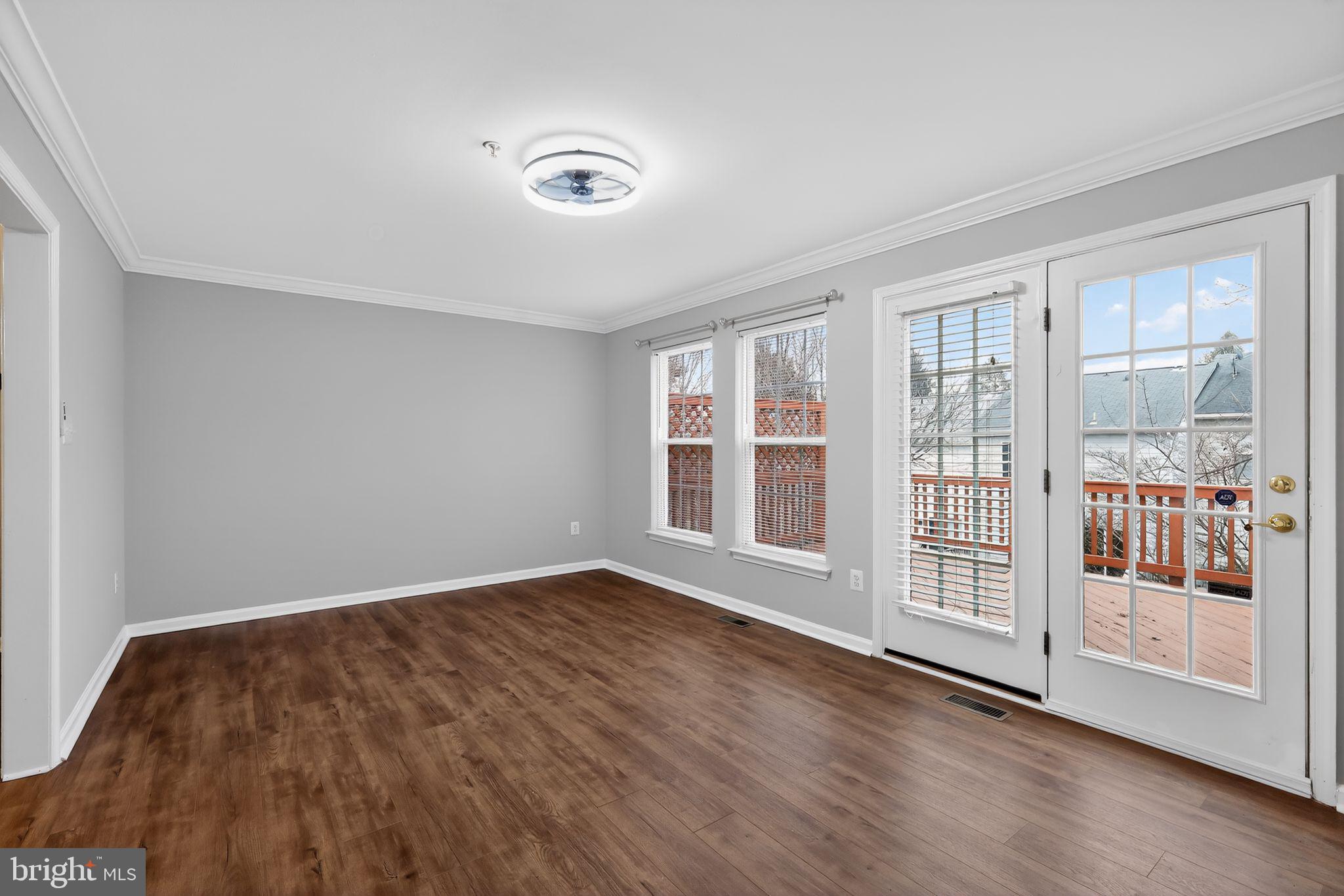 18707 Little Star Lane Germantown, MD 20874 - Photo 12 of 30 a view of an empty room with wooden floor and a window