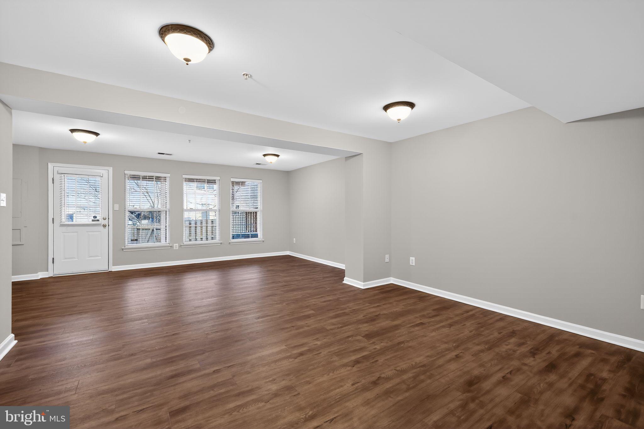 18707 Little Star Lane Germantown, MD 20874 - Photo 13 of 30 wooden floor in an empty room with a window