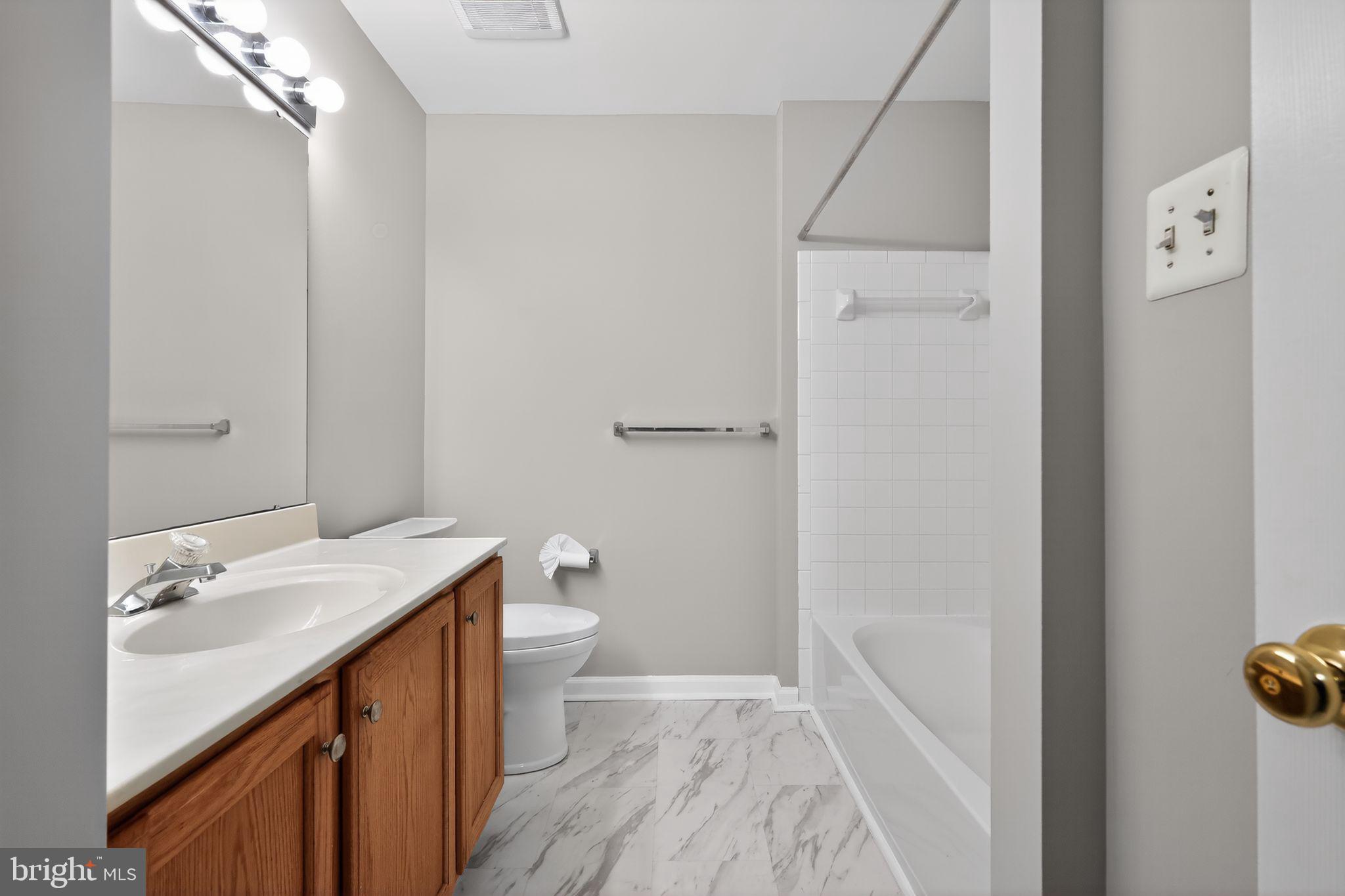 18707 Little Star Lane Germantown, MD 20874 - Photo 25 of 30 a bathroom with a sink and a mirror