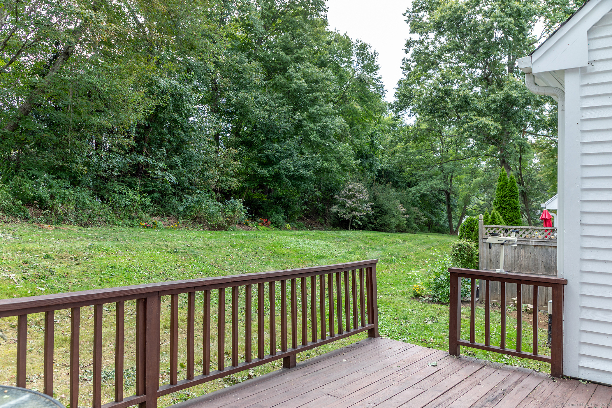 29 Quarry Ridge Road, Unit 29 Washington, CT 06777 - Photo 16 of 19 a view of deck with wooden floor and fence