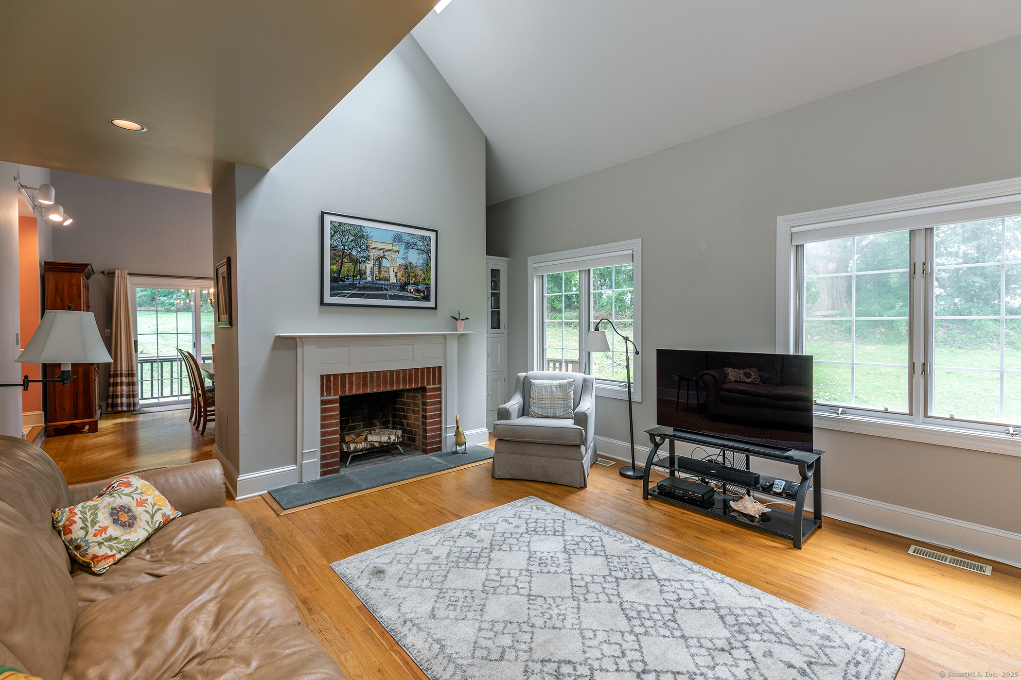 29 Quarry Ridge Road, Unit 29 Washington, CT 06777 - Photo 6 of 19 a living room with furniture a flat screen tv and a fireplace