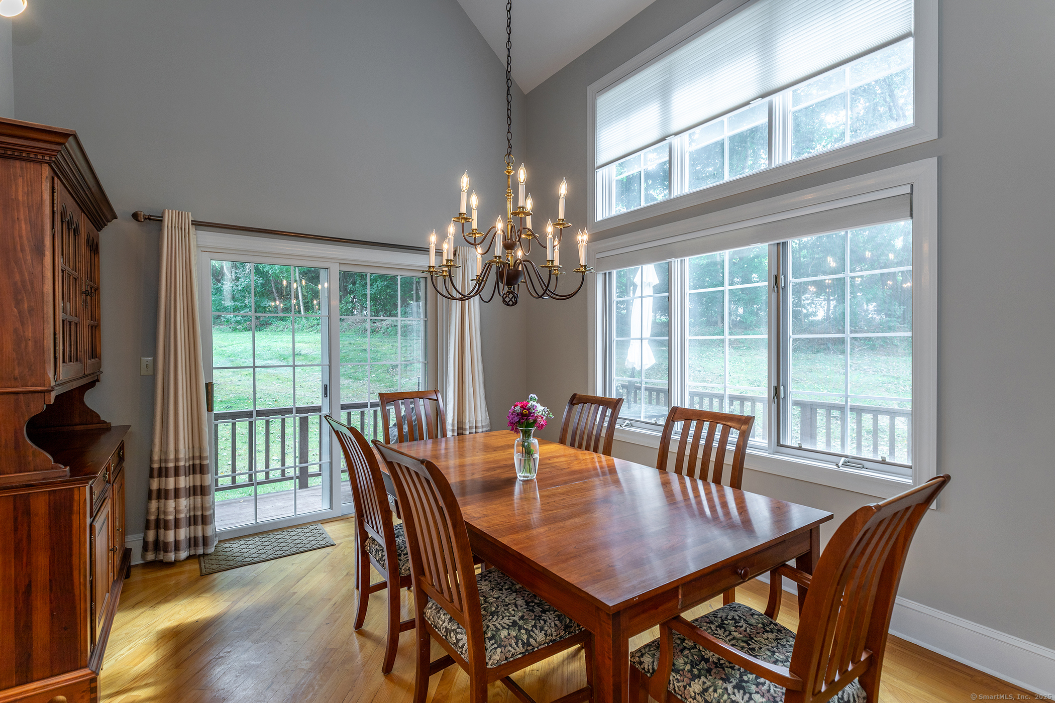 29 Quarry Ridge Road, Unit 29 Washington, CT 06777 - Photo 7 of 19 a view of a dining room with furniture a chandelier and wooden floor