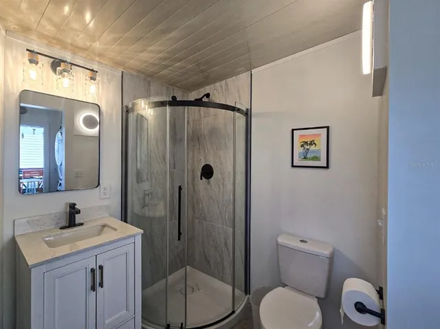 a view of a chairs and table in a patio