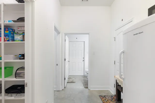 a view of staircase with lots of frames on wall