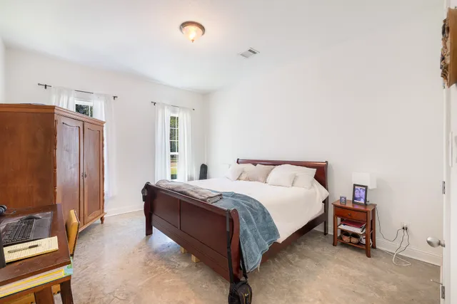 a bed room with a bed and a couch