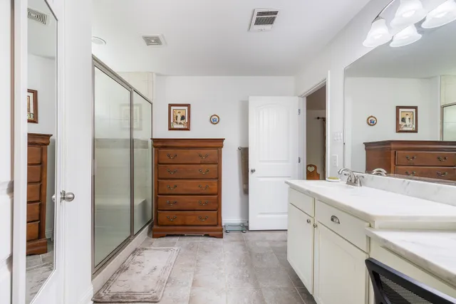 a living room with furniture and a piano