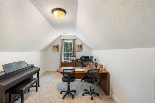 an empty room with closet and windows