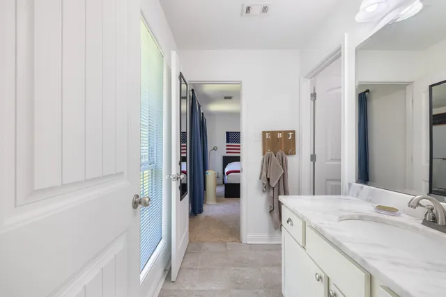 a white toilet sitting next to a shower curtain