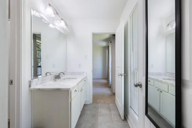 a bedroom with bed and a couch