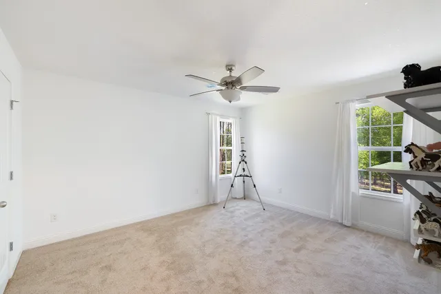 a bathroom with a double vanity sink toilet and shower