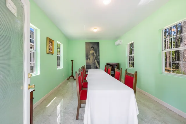 a view of a swimming pool with an outdoor space and seating area