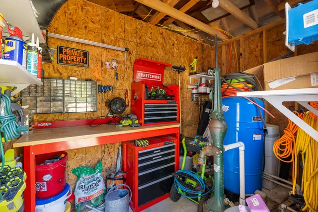 a view of dirt yard with large trees
