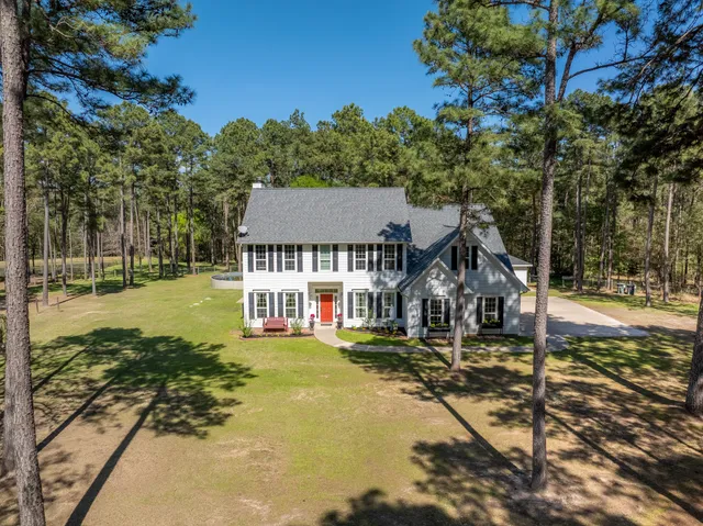 a view of a field with trees