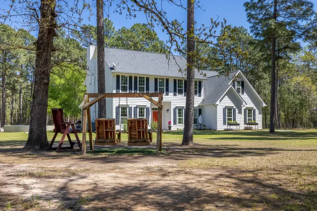 a view of a yard with trees