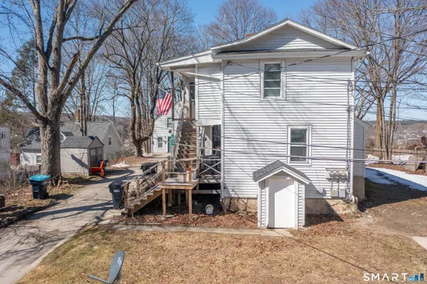 an aerial view of a house with a yard