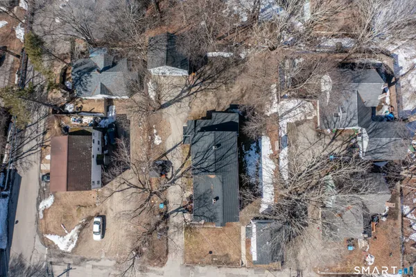 a kitchen with cabinets and wooden floor