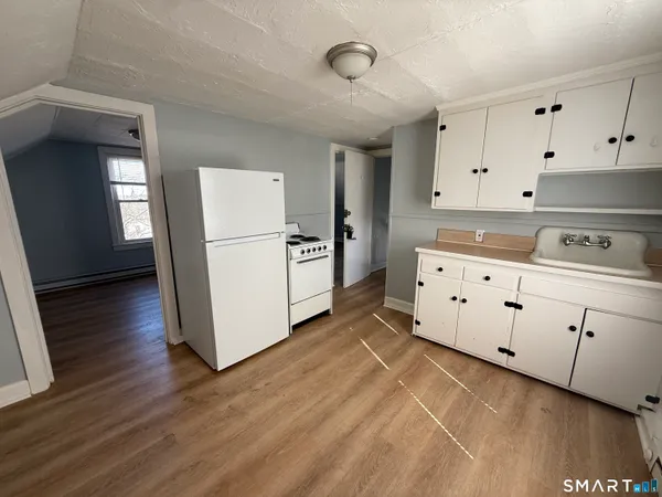 a bathroom with a sink and toilet