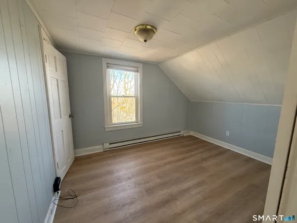 a kitchen with stainless steel appliances granite countertop a refrigerator a stove and a refrigerator