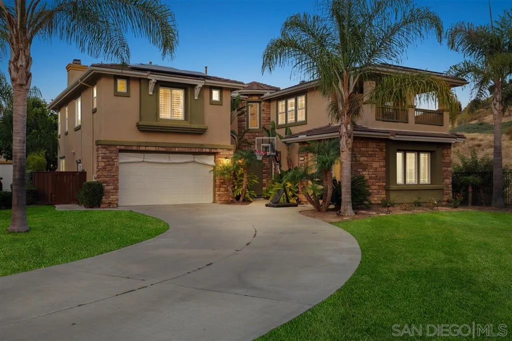8403 Watson Ranch Road San Diego, CA 92129 - Photo 1 of 25 a front view of a house with garden