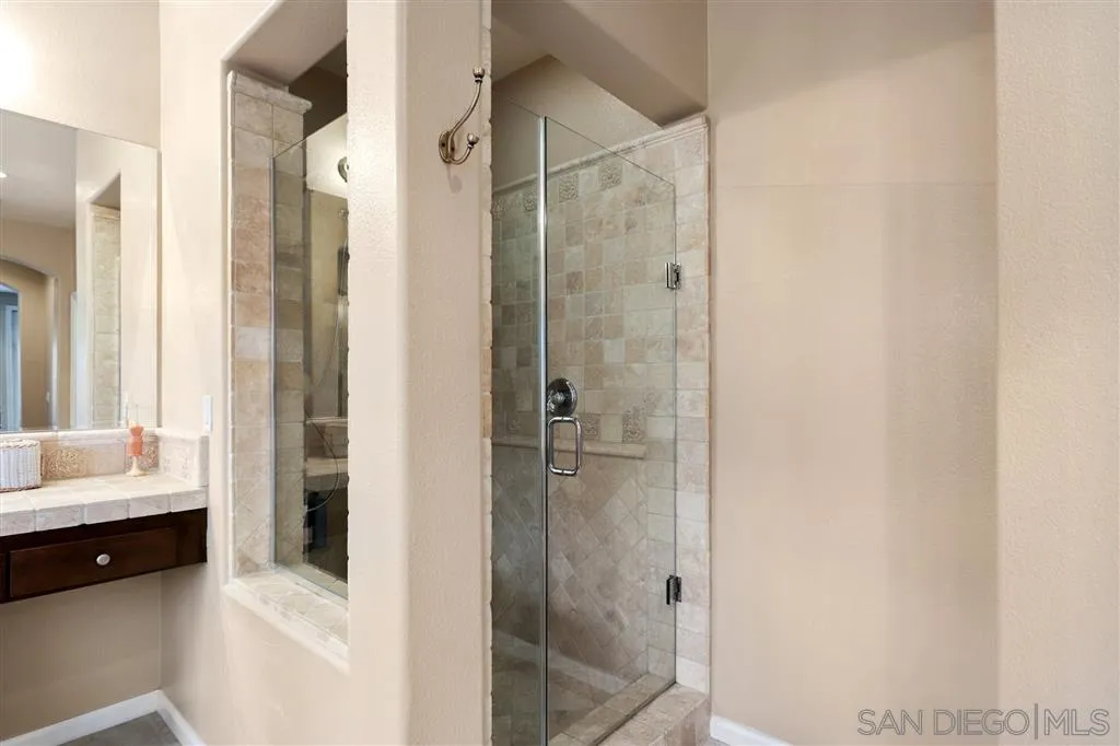 8403 Watson Ranch Road San Diego, CA 92129 - Photo 19 of 25 a en suite bathroom with a sink and a shower