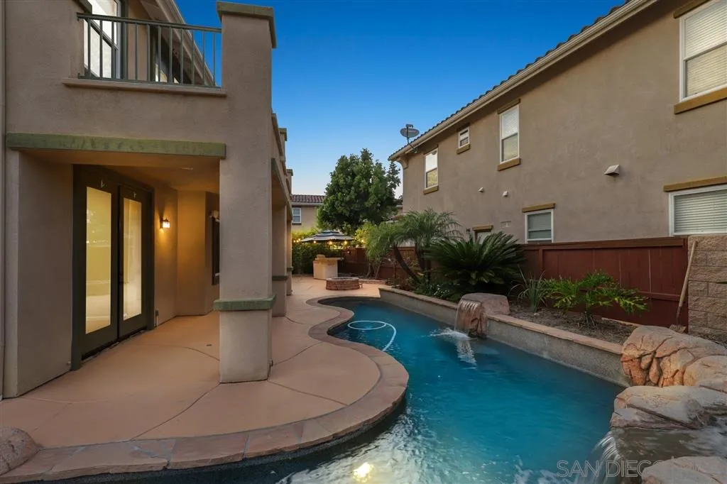 8403 Watson Ranch Road San Diego, CA 92129 - Photo 20 of 25 a view of a patio with couches table and chairs with potted plants