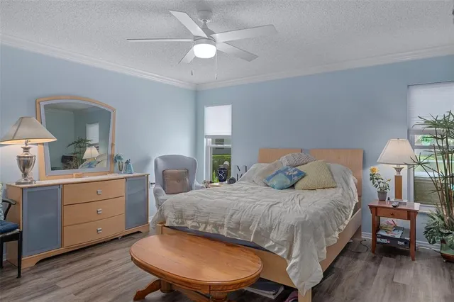 a view of a kitchen with stainless steel appliances granite countertop a sink and a refrigerator