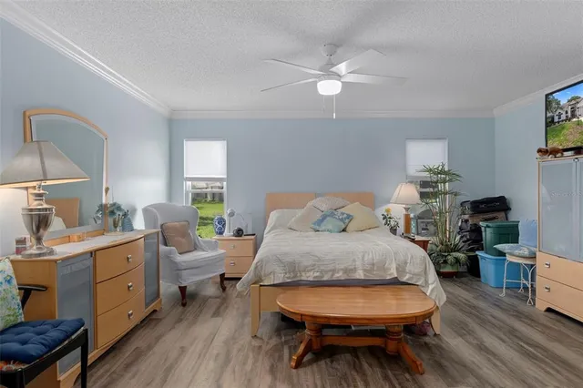 a view of a patio with a table chairs and a backyard