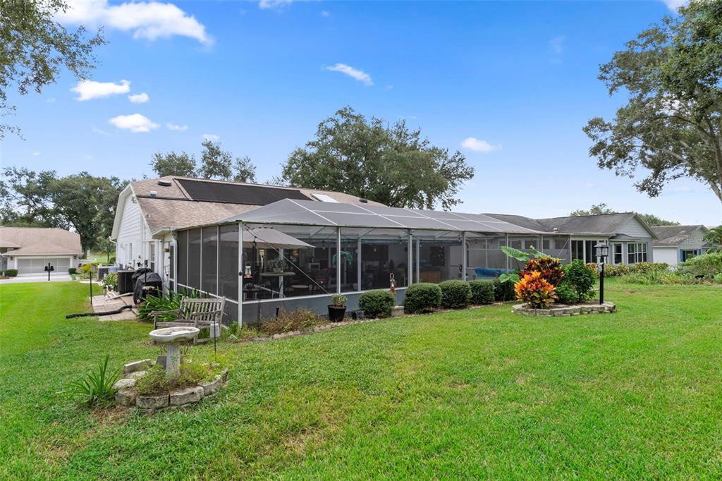 2345 Terrace View Lane Spring Hill, FL 34606 - Photo 49 of 95 a view of a house with a yard and sitting area