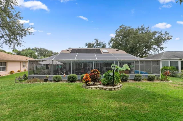 a view of a city with lawn chairs and a yard