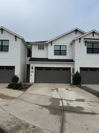 a front view of a house with yard