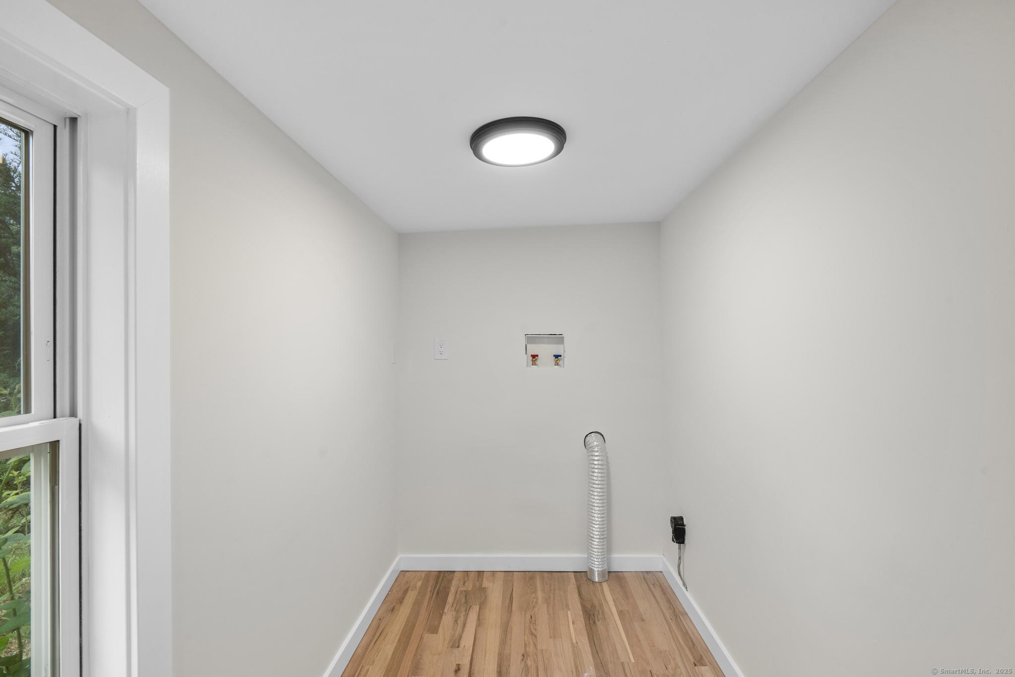 123 Lower Road North Canaan, CT 06024 - Photo 11 of 38 a view of a room with wooden floor and window