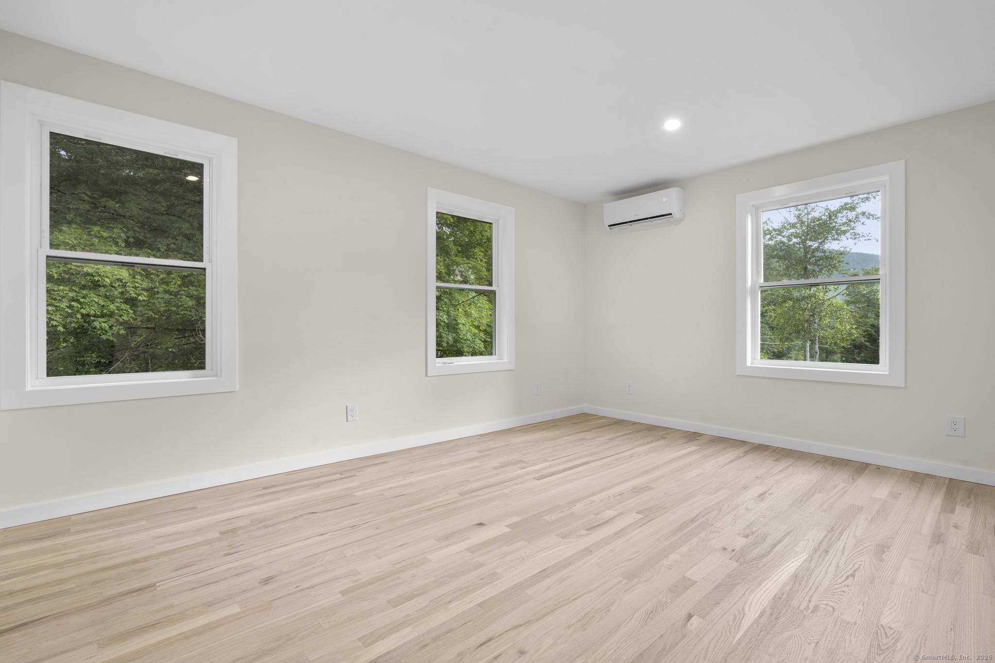 123 Lower Road North Canaan, CT 06024 - Photo 21 of 38 a view of an empty room with wooden floor and a window