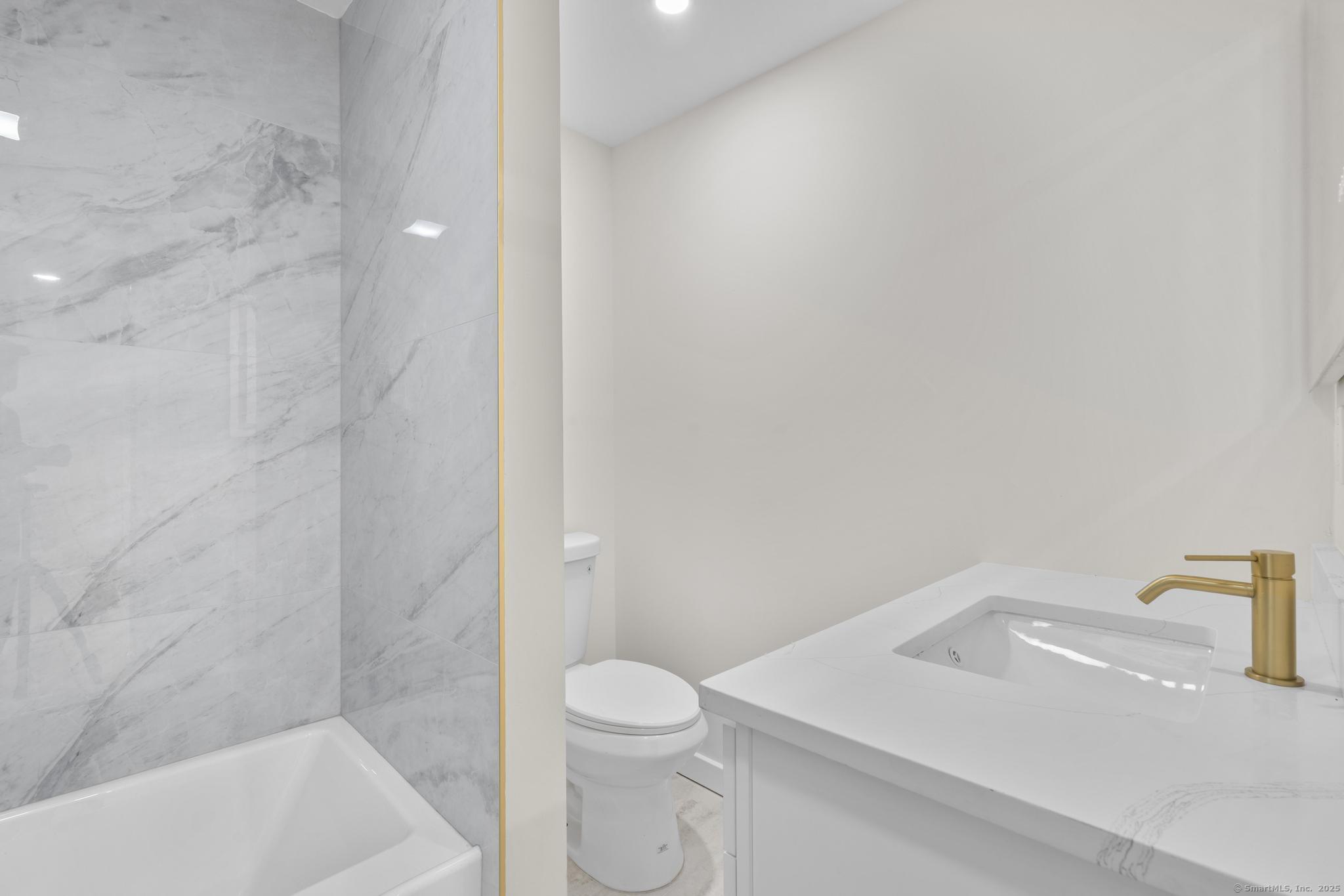 123 Lower Road North Canaan, CT 06024 - Photo 27 of 38 a bathroom with a sink a toilet and shower